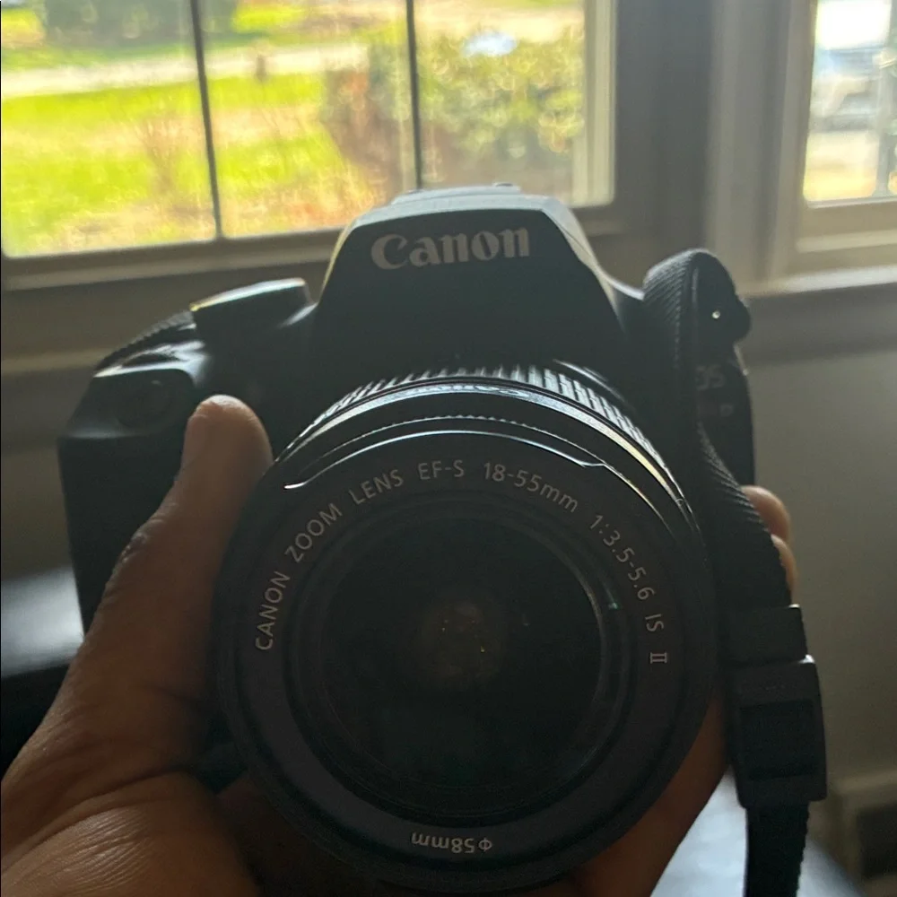 Canon DSLR Camera in Black with Red-Trim Strap
